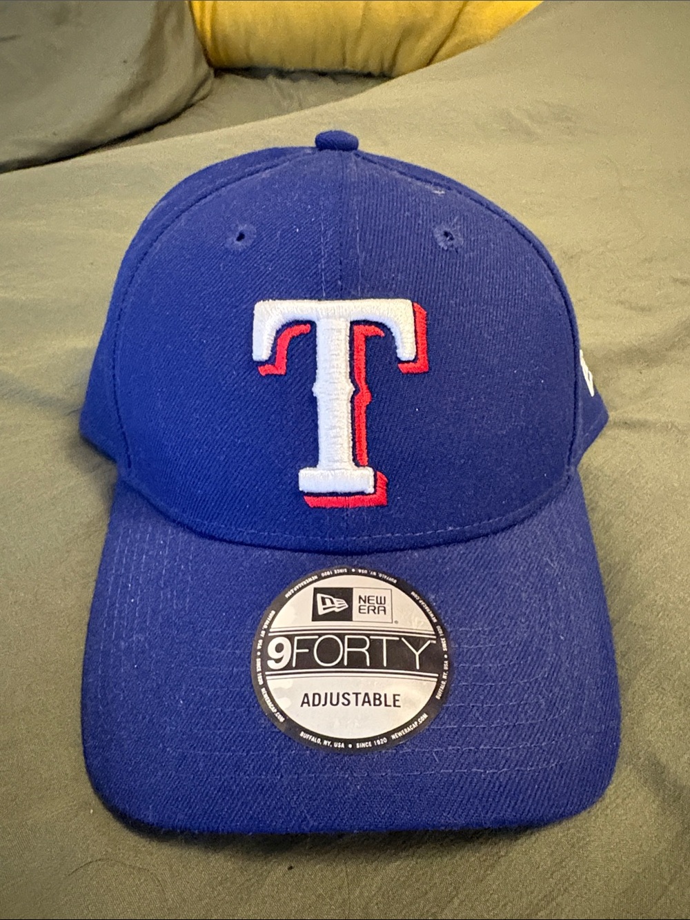 New Era Blue Baseball Cap with White and Red T Logo